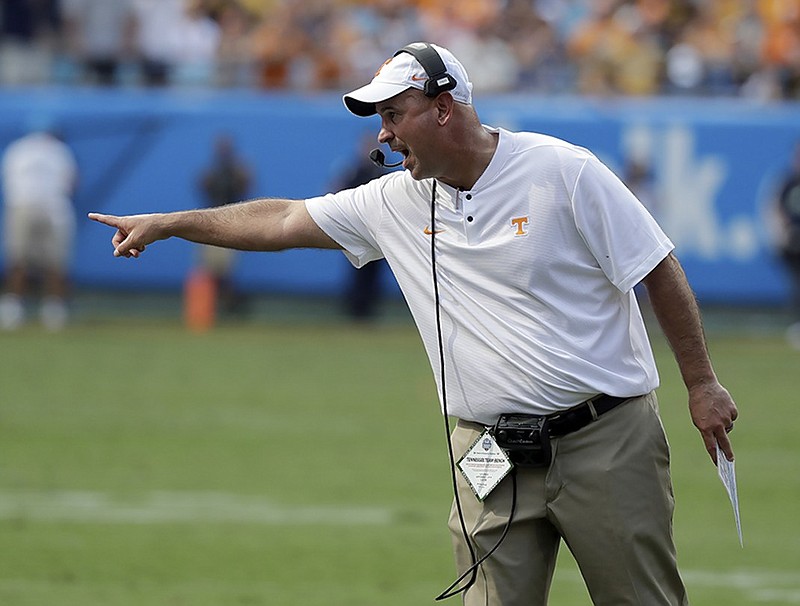 Jeremy Pruitt made his head coaching debut Saturday as Tennessee took on West Virginia in Charlotte, N.C.