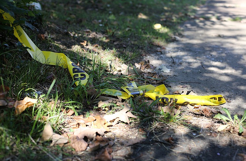 Crime scene tape remains strewn across the sidewalk in the 2100 block of Vance Avenue Tuesday, September 4, 2018 in Chattanooga, Tennessee. A shooting occurred at an apartment building on the block Monday evening.