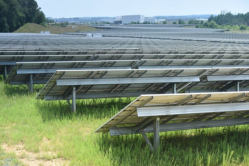 Volkswagen's 65-acre solar farm stretches to the north from its main buildings at the automotive factory campus.