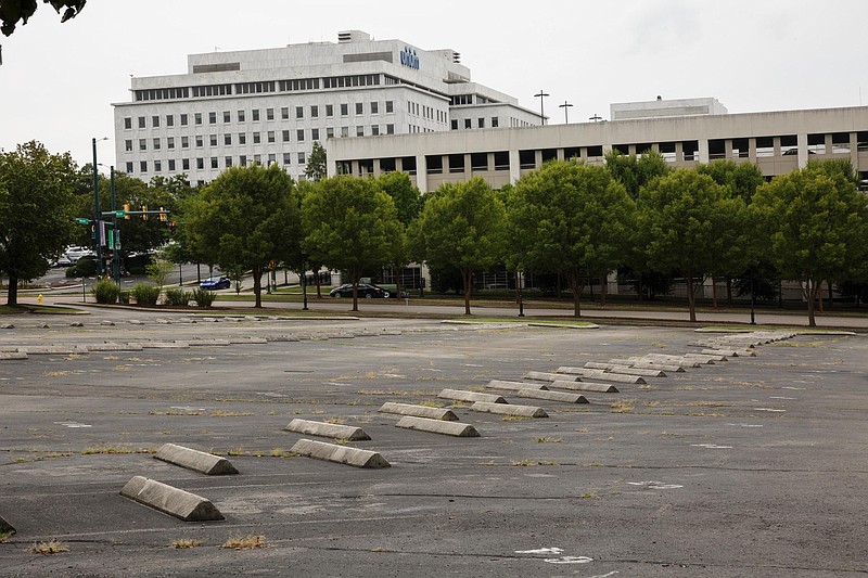 A Unum Group parking lot which is the planned site of new apartments and town-homes is seen on Wednesday, Sept. 5, 2018, in Chattanooga, Tenn. About 163 units are planned for the area, along with a parking deck.