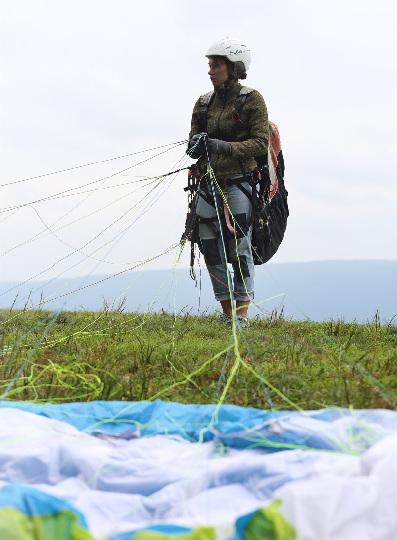 Silvie Sturmova gets her paraglider ready before the Hurricane Open 2018 paragliding event Wednesday, September 5, 2018 in Whitwell, Tennessee. Wednesday was Sturmova's first time paragliding off of a mountain.