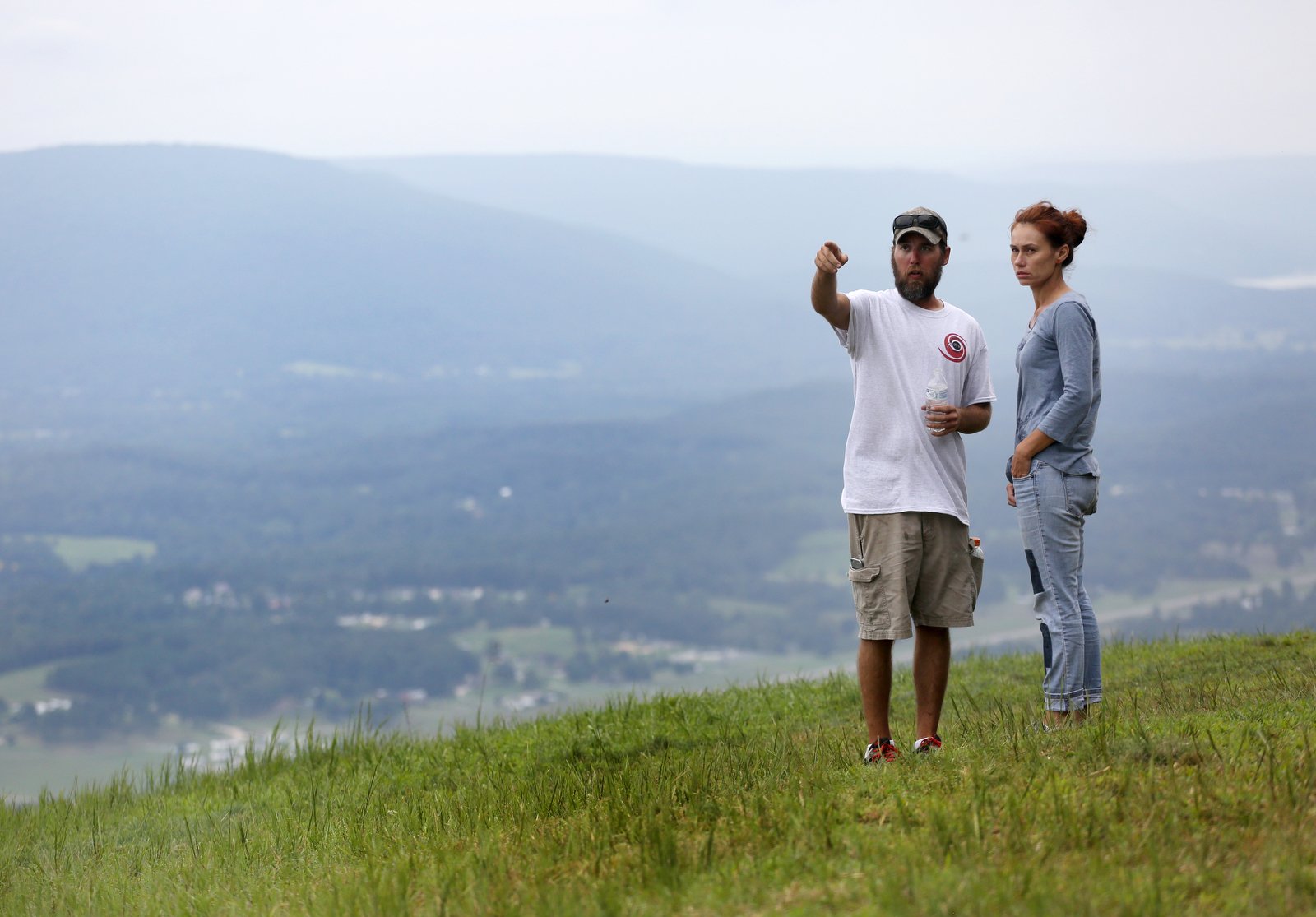 Travis Walter points out features along the mountain to Silvie Sturmova before the Hurricane Open 2018 paragliding event Wednesday, September 5, 2018 in Whitwell, Tennessee. Both are from Chicago and traveled to Whitwell for the event.