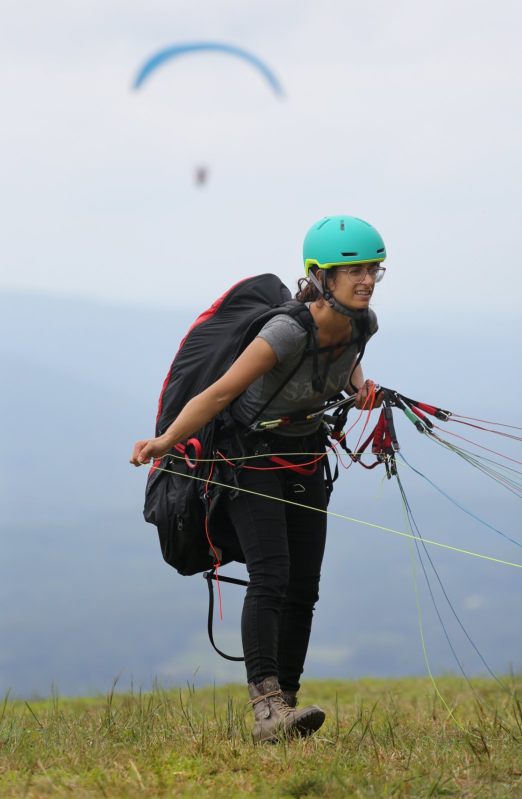Hailey Hebert of Lafayette, Louisiana, gets her paraglider prepared before the Hurricane Open 2018 paragliding event Wednesday, September 5, 2018 in Whitwell, Tennessee. Hebert started paragliding in April 2018 and did her training in Whitwell.