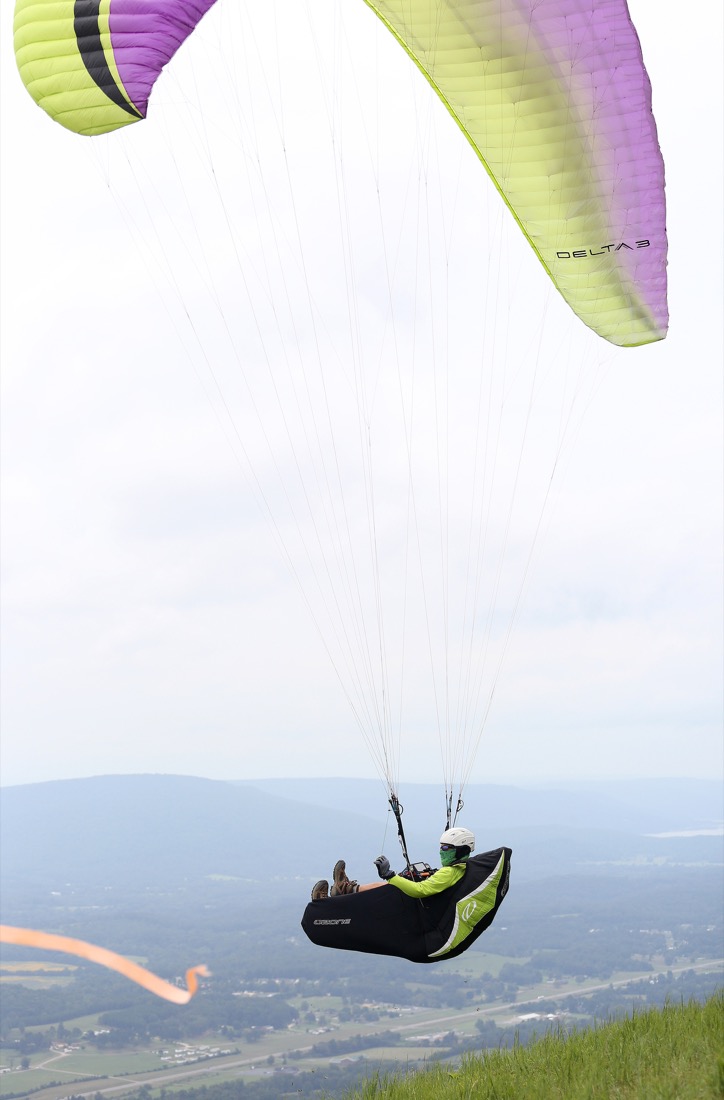 Rick Jacob, paragliding land owner, takes off the side of the mountain during the Hurricane Open 2018 paragliding event began Wednesday, September 5, 2018 in Whitwell, Tennessee. Jacob helped organize the event.