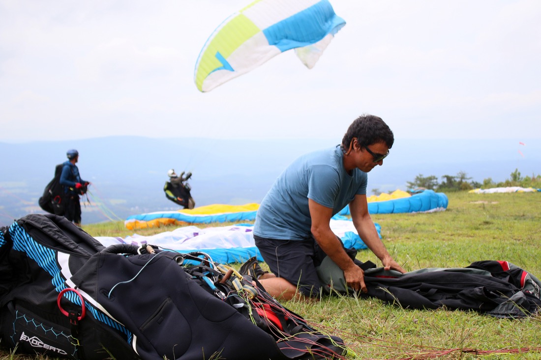 Alejandro Albornoz gets his paraglider ready before the Hurricane Open 2018 paragliding event Wednesday, September 5, 2018 in Whitwell, Tennessee. Albornoz has been paragliding for 18 years.