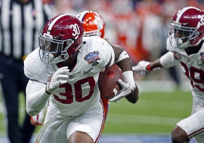 Alabama linebacker Mack Wilson (30) intercepts a pass and returns it for a touchdown in the second half of the Sugar Bowl semi-final playoff game against Clemson for the NCAA college football national championship, in New Orleans, Monday, Jan. 1, 2018. (AP Photo/Butch Dill)