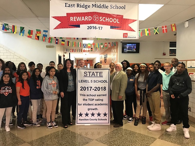 Students at East Ridge Middle School joined Principal Angela Cass and other school administrators when the Level 5 championship banner was presented to the school by former District 8 Board Member David Testerman and Superintendent Bryan Johnson. East Ridge Middle earned a TVAAS composite score of 5 in both 2017 and 2018. / Contributed Photo/Times Free Press