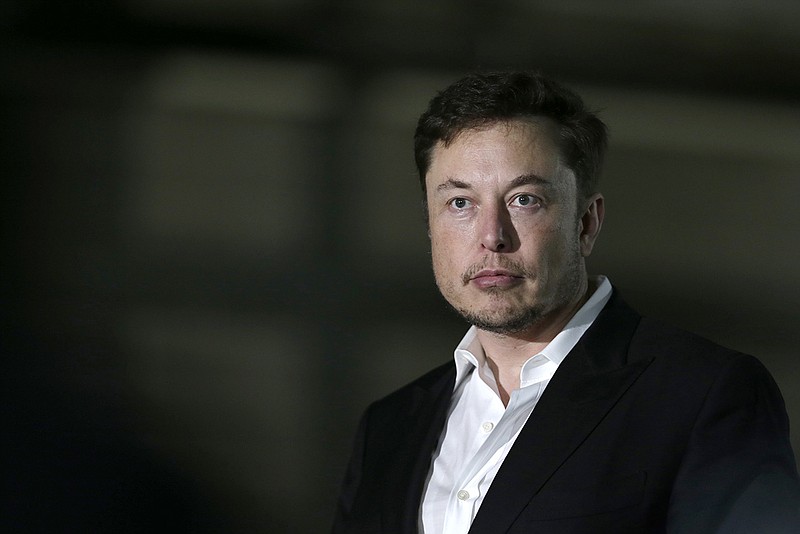 In this June 24, 2018, file photo Tesla CEO and founder of the Boring Company Elon Musk speaks at a news conference in Chicago. Shares of electric car maker Tesla Inc. tumbled over 9 percent as the markets opened Friday, Sept. 7, after the CEO smoked marijuana during a YouTube video podcast and the company's accounting chief left after a month on the job. (AP Photo/Kiichiro Sato, File)