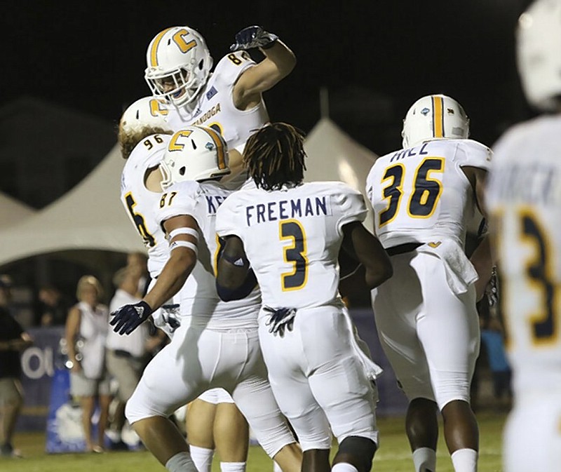 UTC tight end Jordan Giberti leaps in celebration after catching the winning two-point conversion during Saturday night's SoCon opener at The Citadel.