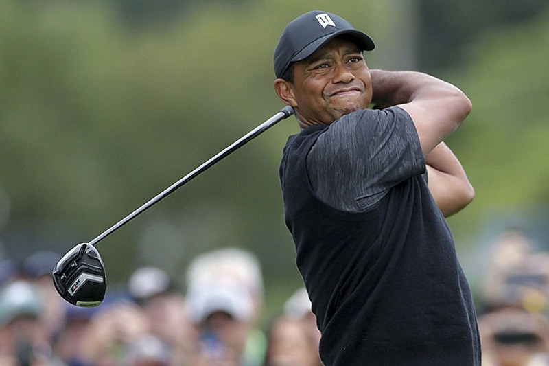 Tiger Woods tees off on the 10th hole Saturday during the third round of the BMW Championship.