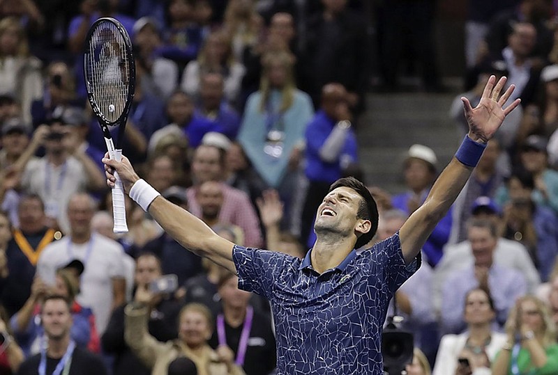 Novak Djokovic celebrates after beating Juan Martin del Potro to win the U.S. Open on Sunday in New York.