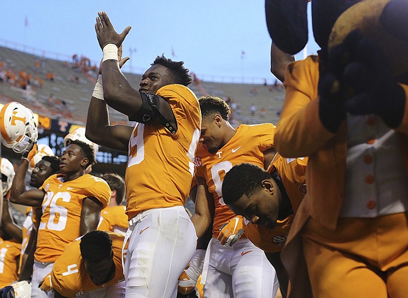 Tennessee linebacker Jonathan Kongbo (99) celebrates with teammates after Saturday's home win against East Tennessee State.