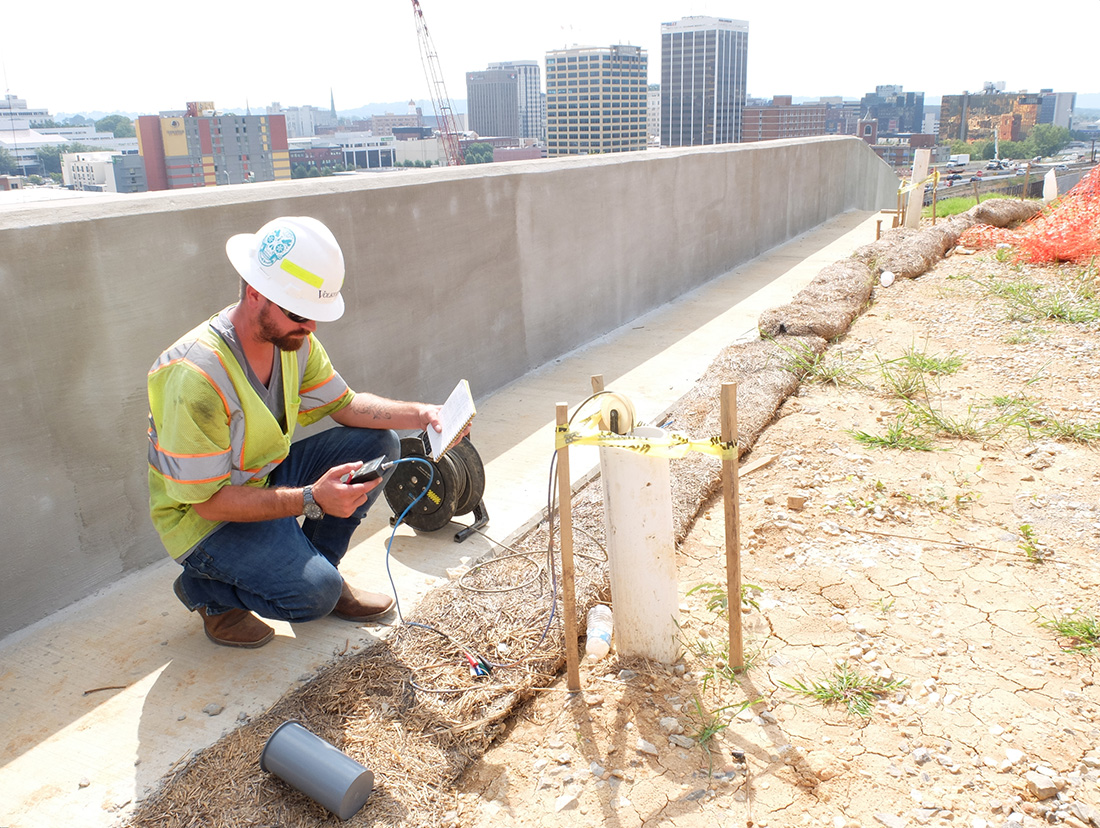 Grady Stageberg, construction engineer inspector for Volkert Inc., takes and records inclinometer readings from a 68-foot vertical core shaft high above the U.S. Highway 27 retaining wall in view of the 4th Street interchange. The Sept. 6, 2018 reading was a weekly test at this point in the project, according to Stageberg.