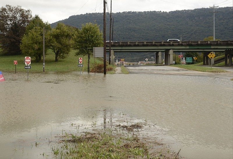 Cummings Highway remains closed near the I-24 exit on Tuesday afternoon, Oct. 14, 2104, after heavy overnight rains caused localized flooding. One car was submerged at the end of the westbound exit ramp and was removed by wrecker. 