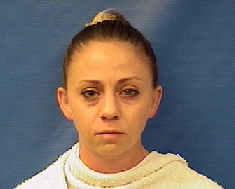 This photo provided by the Kaufman County Sheriff's Office shows Amber Renee Guyger. Guyger, a Dallas police officer, was arrested Sunday, Sept. 9, 2018, on a manslaughter warrant in the shooting of a black man at his home, Texas authorities said. The Texas Department of Public Safety said in a news release that Guyger was booked into the Kaufman County Jail and that the investigation is ongoing. It said no additional information is available at this time. (Kaufman County Sheriff's Office via AP)