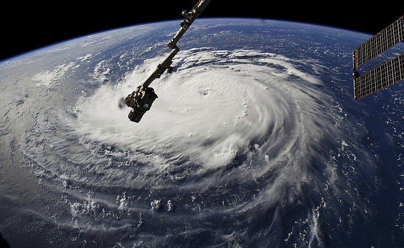 This photo provided by NASA shows Hurricane Florence from the International Space Station on Monday, Sept. 10, 2018, as it threatens the U.S. East Coast. Forecasters said Florence could become an extremely dangerous major hurricane sometime Monday and remain that way for days. (NASA via AP)