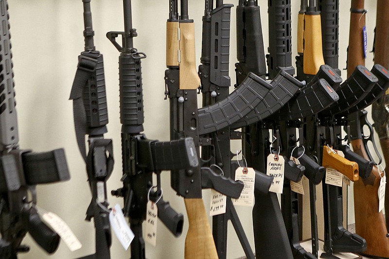 This March 1, 2018, file photo shows a display of various models of semi-automatic rifles at a store in Pennsylvania. Research published Tuesday, Sept. 11, 2018 in the Journal of the American Medical Association shows active shooters with semi-automatic rifles wound and kill twice as many people as those using non-automatic weapons. (AP Photo/Keith Srakocic)