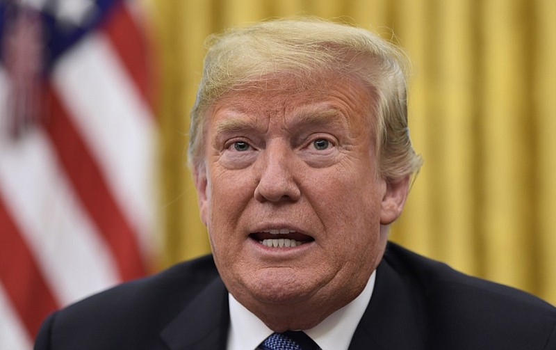 President Donald Trump talks about Hurricane Florence following a briefing in the Oval Office of the White House in Washington, Tuesday, Sept. 11, 2018. (AP Photo/Susan Walsh)

