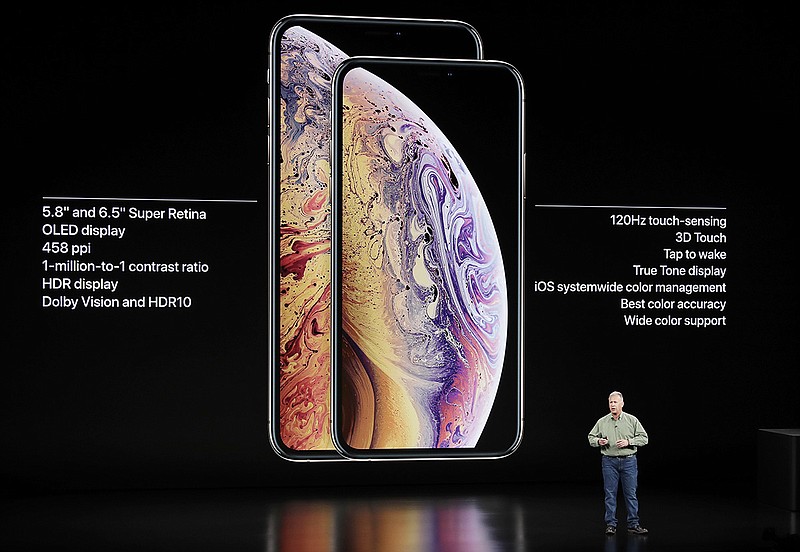 Phil Schiller, Apple's senior vice president of worldwide marketing, speaks about the Apple iPhone XS and Apple iPhone XS Max at the Steve Jobs Theater during an event to announce new Apple products Wednesday, Sept. 12, 2018, in Cupertino, Calif. (AP Photo/Marcio Jose Sanchez)