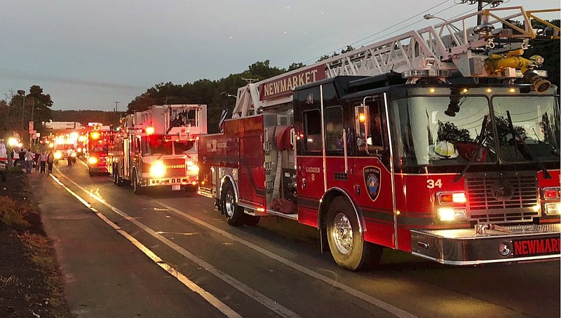 Multiple fire trucks from surrounding communities arrive Thursday, Sept. 13, 2018, in Lawrence, Mass., responding to a series of gas explosions and fires triggered by a problem with a gas line that feeds homes in several communities north of Boston. (AP Photo/Phil Marcelo)

