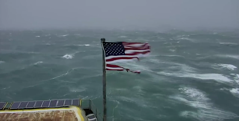 A U.S. flag can be seen in this screenshot from a camera set up at Frying Pan Tower off the North Carolina coast. Viewers can watch live footage of Hurricane Florence as it rages toward the U.S.