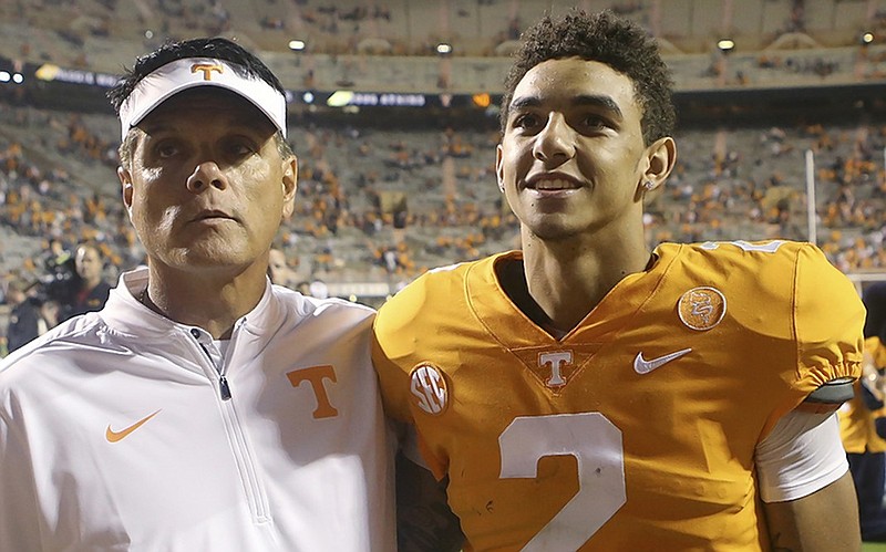 University of Tennessee quarterback Jarrett Guarantano stands with quarterbacks coach Mike Canales as the team celebrates last November's home win against Southern Miss. While Guarantano is still with the Vols, Canales is now the offensive coordinator at UTEP, which visits Knoxville today for a nonconference matchup.