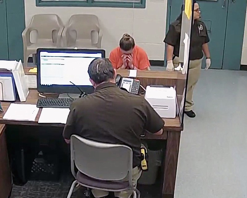 This photo from video released Thursday, Sept. 13, 2018, by the Kaufman County Sheriff's Office in Kaufman, Texas, shows Dallas police Officer Amber Guyger getting booked after turning herself in Sunday, Sept. 9 following the fatal shooting of Botham Jean in his own apartment. Guyger was arrested manslaughter and has since been released on bond. (Kaufman County Sheriff's Office Jail via AP)

