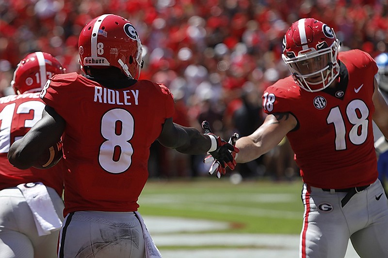Georgia wide receiver Riley Ridley celebrates with tight end Isaac Nauta after scoring a touchdown during the first half of Saturday's win against Middle Tennessee State in Athens, Ga.