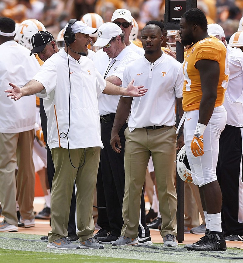 Tennessee football coach Jeremy Pruitt questions Matthew Butler about a roughing-the-passer penalty during Saturday's game against UTEP at Neyland Stadium. The host Vols won 24-0 to improve to 2-1 overall before beginning SEC play next week.