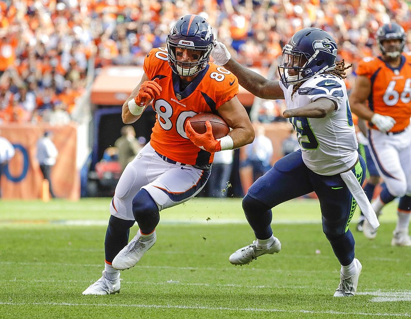 Denver Broncos tight end Jake Butt (80) runs against Seattle Seahawks linebacker Shaquem Griffin (49) during the second half of an NFL football game on Sept. 9 in Denver. (AP Photo/Jack Dempsey)