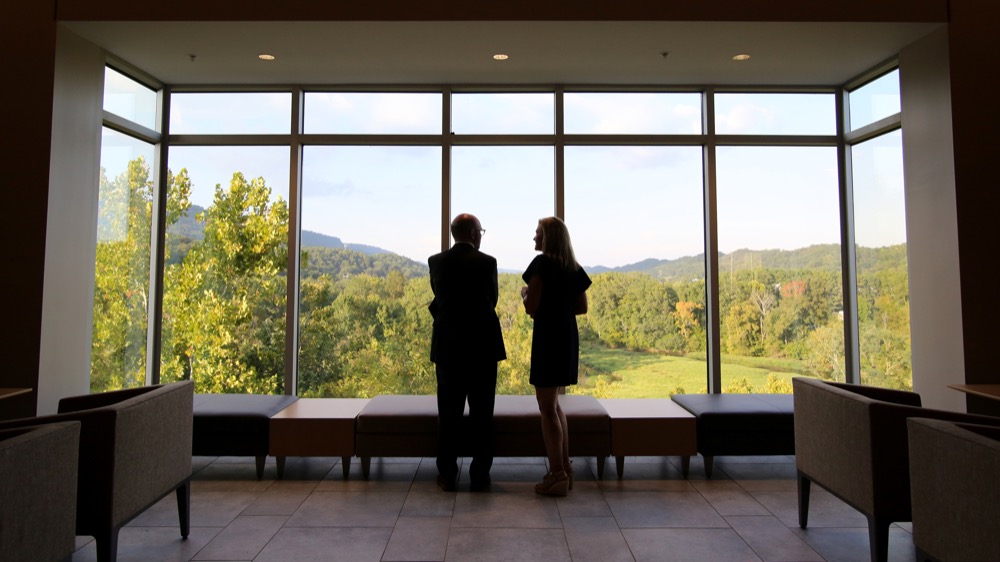 Staff photo by Erin O. Smith /
Bob Franklin, the architect for the Scotty Probasco Academic Center, and Susan Wilson look out over the view from the third floor of the academic center following its dedication ceremony Wednesday, September 19, 2018 at Baylor School in Chattanooga, Tennessee. Many of the academic center's windows give a view the scenic campus.