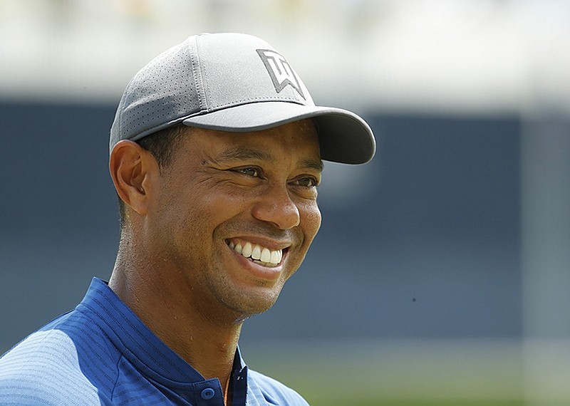 Tiger Woods smiles during practice for the PGA Championship in August. Woods is happy to be back at the PGA Tour's season-ending Tour Championship, which starts today at East Lake Golf Club in Atlanta, for the first time since 2013.