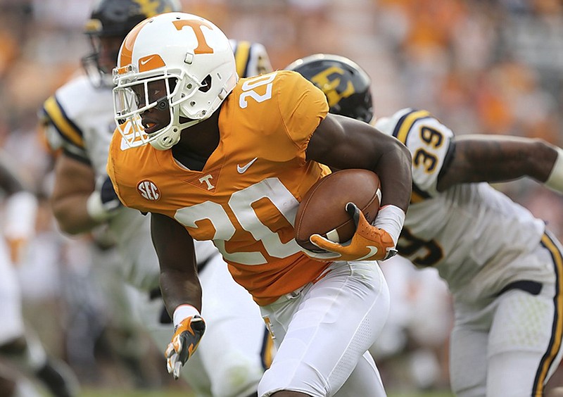 Tennessee defensive back Bryce Thompson runs with the ball after intercepting a deflected pass during the first half of a home win against East Tennessee State on Aug. 8. Thompson is one of eight players who have spent time at defensive back for the Vols during their first three games this season.