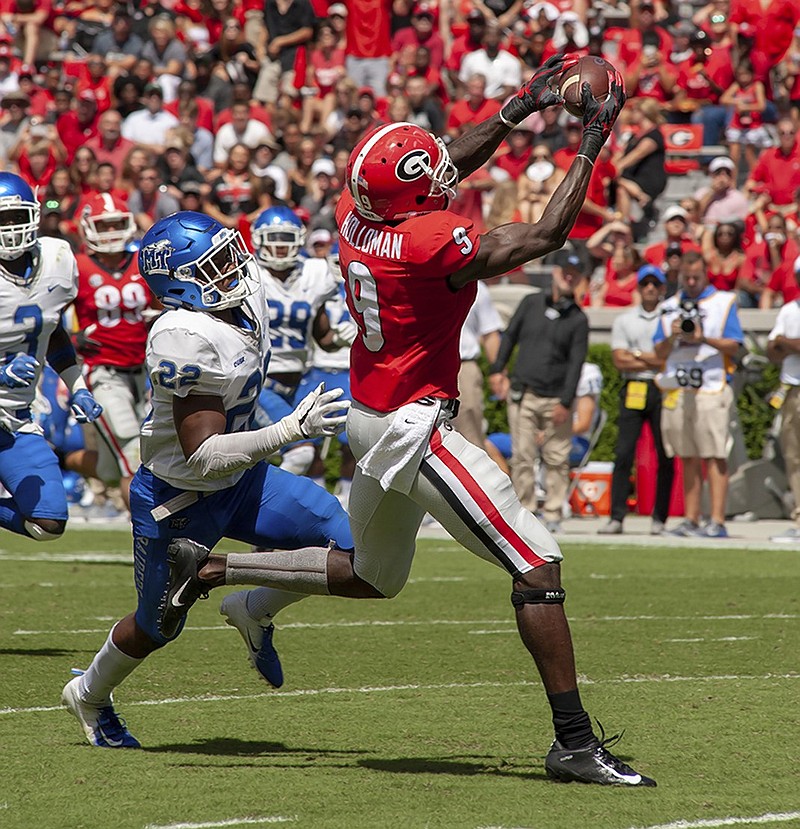 Georgia sophomore receiver Jeremiah Holloman hauls in a 65-yard catch during last Saturday's 49-7 dismantling of Middle Tennessee State.