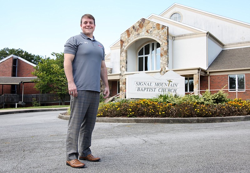 Dr. Sam Greer, senior pastor of Red Bank Baptist Church, stands before Signal Mountain Baptist Church, which Red Bank Baptist is in the process of acquiring.