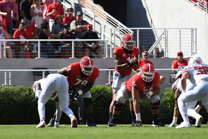 Georgia 6-foot-7, 340-pound right tackle Isaiah Wilson (79) and 6-6, 335-pound right guard Ben Cleveland (74) give the Bulldogs a noticeably bigger offensive line than in their last trip to Missouri.