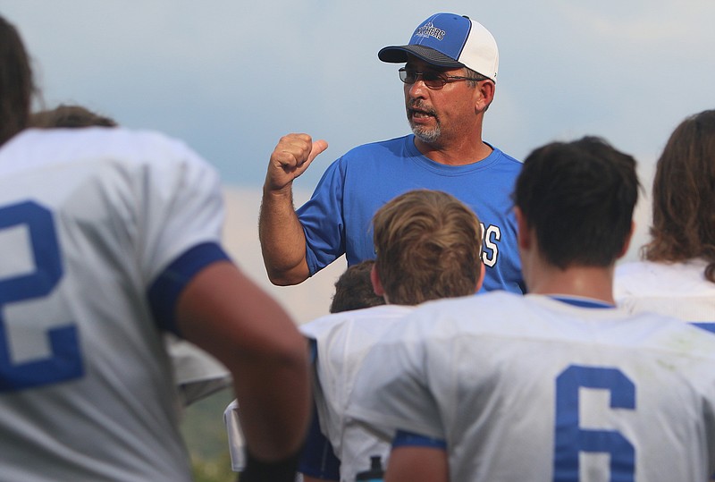 Sale Creek football coach Ron Cox speaks with his team during a break in a scrimmage at Silverdale Baptist on Aug. 4, 2017. Last Friday, the Panthers beat Copper Basin for their first region win in two years.