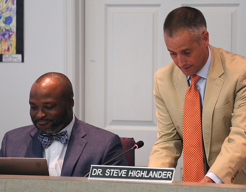 At right, Hamilton County School Board Chairman Joe Wingate changes seats with Dr. Steve Highlander following his appointment as the new chairman during the Hamilton County School Board meeting Thursday, September 20, 2018 at the Hamilton County Department of Education in Chattanooga, Tennessee. The school board names a new chairman and vice-chairman during the meeting.