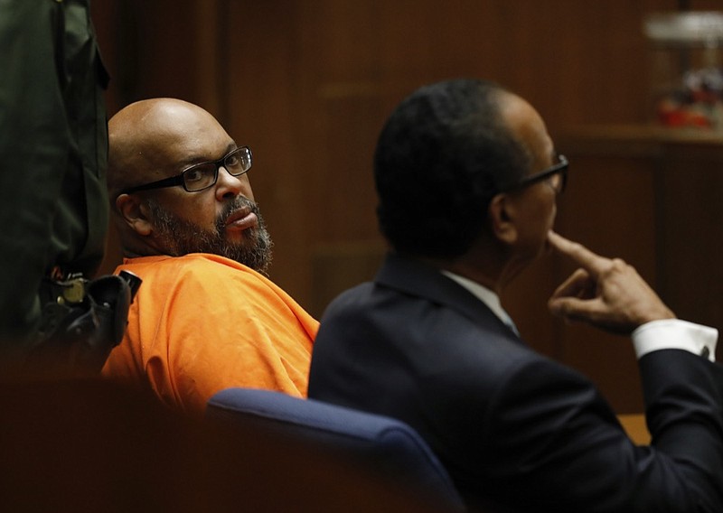 Former rap mogul Marion "Suge" Knight, left with his defense attorney Albert DeBlanc Jr., pleads no contest to voluntary manslaughter Thursday, Sept. 20, 2018 after he ran over two men, killing one, nearly four years ago in Los Angeles Superior Court . The Death Row Records co-founder entered the plea Thursday in Los Angeles Superior Court and has agreed to serve 28 years in prison. (Gary Coronado/Los Angeles Times via AP, Pool)


