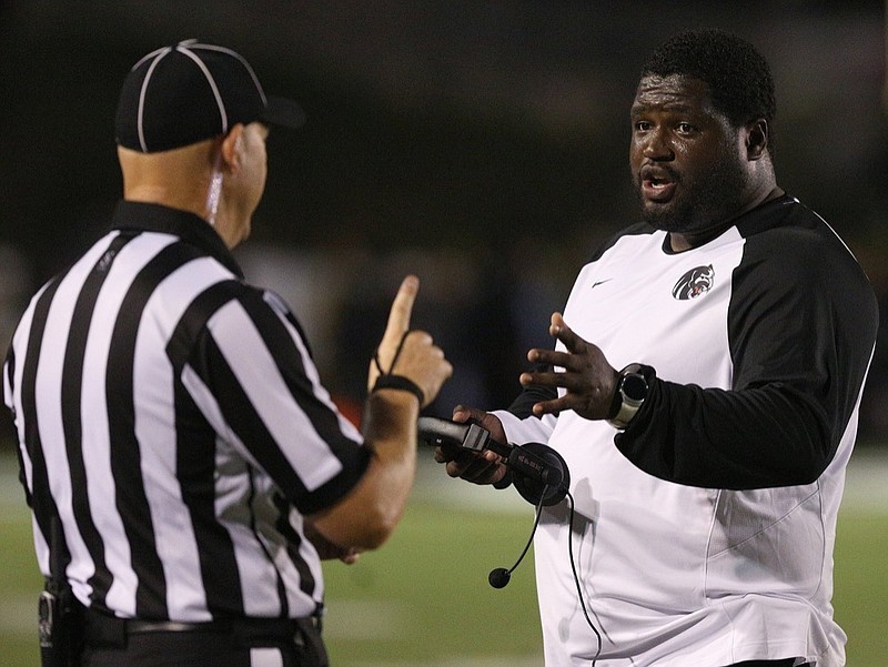 Cortney Braswell speaks with an official during Ridgeland's football game against Heritage on Sept. 21 in Rossville. Braswell has resigned as Ridgeland's coach after one season to take a position at the University of Louisville.