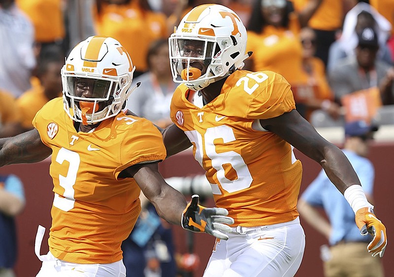 Tennessee defensive back Marquill Osborne (3) and teammate Theo Jackson celebrate after Osborne scored on a blocked punt during the Vols' home win against ETSU on Sept. 8.