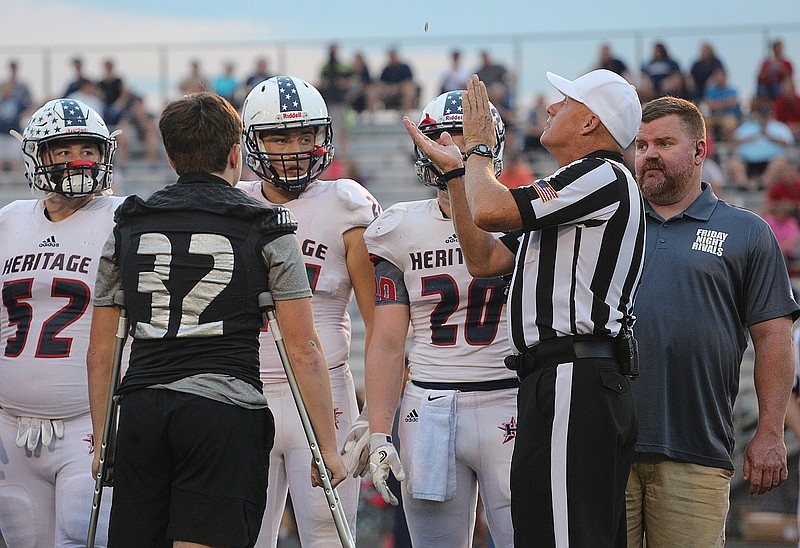 Ridgeland and Heritage captains watch as the coin is flipped before the Ridgeland vs. Heritage football game Friday, September 21, 2018 at Ridgeland High School in Rossville, Georgia.