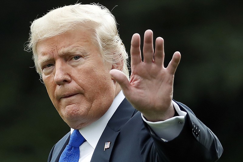 In this Sept. 30, 2018, file photo, President Donald Trump waves as he walks to Marine One on the South Lawn of the White House, in Washington. President Trump challenged the woman accusing his Supreme Court nominee of sexual assault by name, Friday, Sept. 21, 2018, saying that if the alleged attack was that "bad" then she would have filed charges. (AP Photo/Alex Brandon)