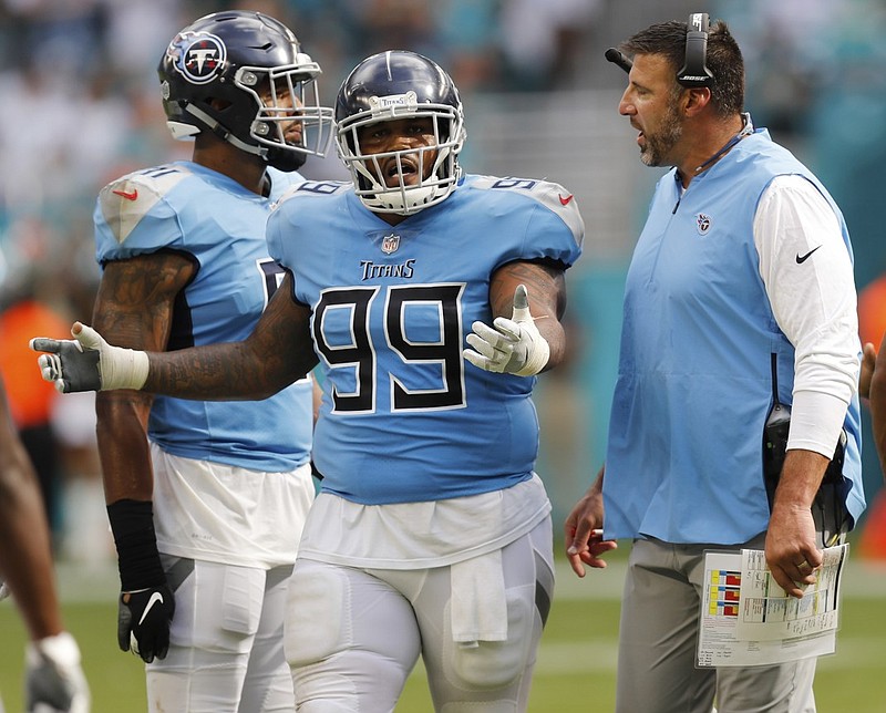 Tennessee Titans coach Mike Vrabel talks to defensive tackle Jurrell Casey (99) during a season-opening loss to the Miami Dolphins.