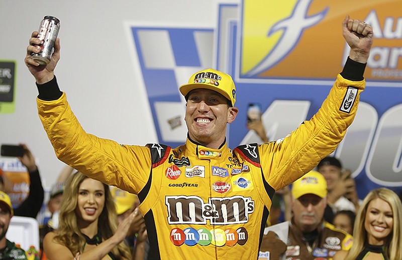 Kyle Busch celebrates after winning Saturday night's NASCAR Cup Series playoff race at Richmond Raceway in Virginia.