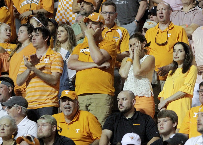 Tennessee fans react to a delay-of-game penalty during Saturday night's game against Florida at Neyland Stadium.