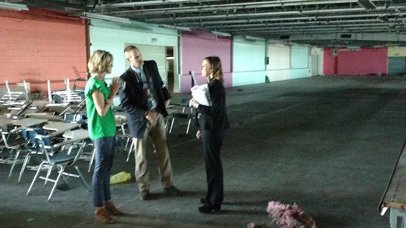 Staff file photo / Bradley County officials check out the closed American Uniform Co. factory last year. The Partnerships in Industry & Education Innovation Center is planned for the 290,000-square-foot facility.