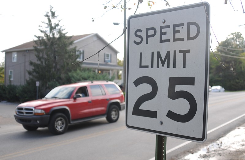 A vehicle drives past a speed limit sign on Mississippi Avenue on Signal Mountain. The Signal Mountain Town Council is considering lowering the speed limit of a portion of nearby James Boulevard from 30 mph to 25 mph.