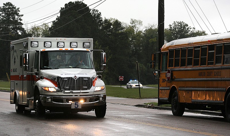 An ambulance leaves Brainerd High School Wednesday, September 26, 2018 in Brainerd, Tennessee. Several students at the school were reported to have illnesses caused by a substance.