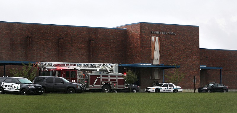 Several Chattanooga Police and Chattanooga Fire vehicles sit in front of Brainerd High School Wednesday, September 26, 2018 in Brainerd, Tennessee. Several Chattanooga Police officers were on scene with K-9 units doing sweeps of the facility for substances while the school was on lockdown.